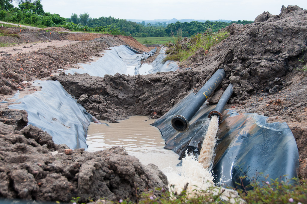 Untreated waste water from mining, which is rich in heavy metals, runs freely down to rice paddies.