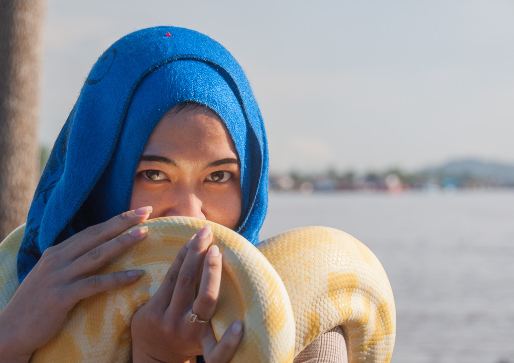 Girl with yellow snake.