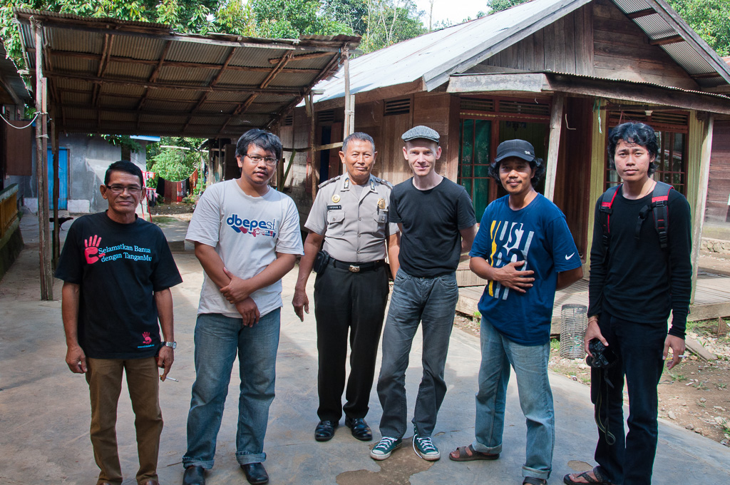 Walhi environmental activists and local indigenous populations are watched by police when sharing stories of coal mining in Central Kalimantan