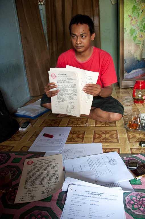 Misran shows his corresponacne with mining giant Adaro, which is planning an expansion on his land.