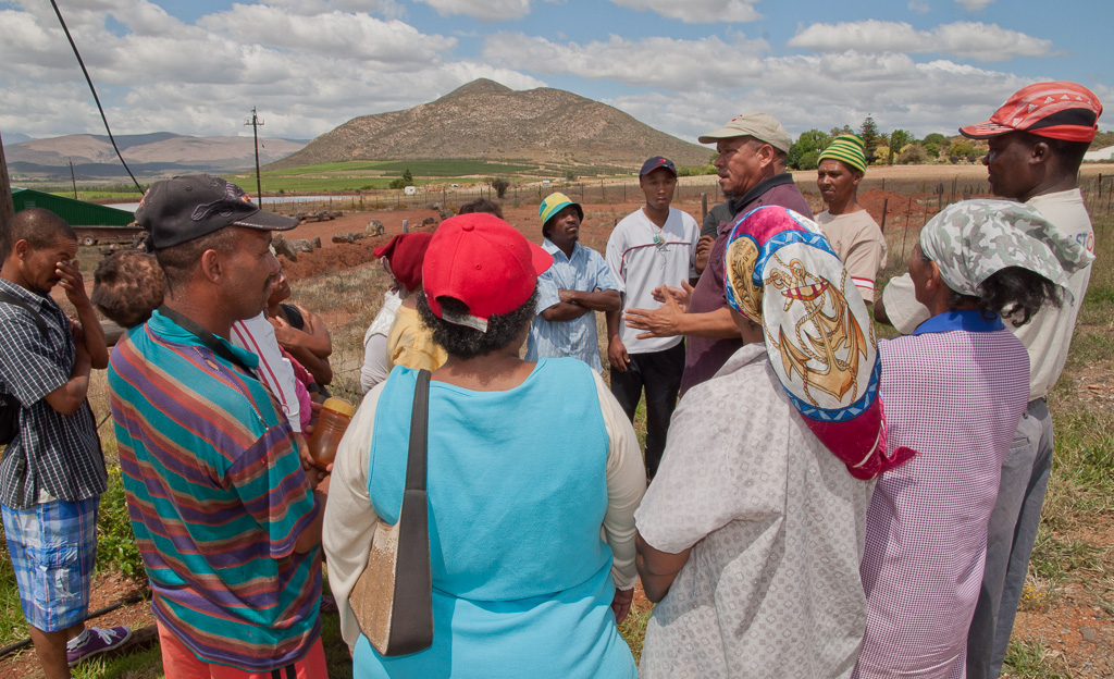 Karel talks to union members outside farm in Robertson